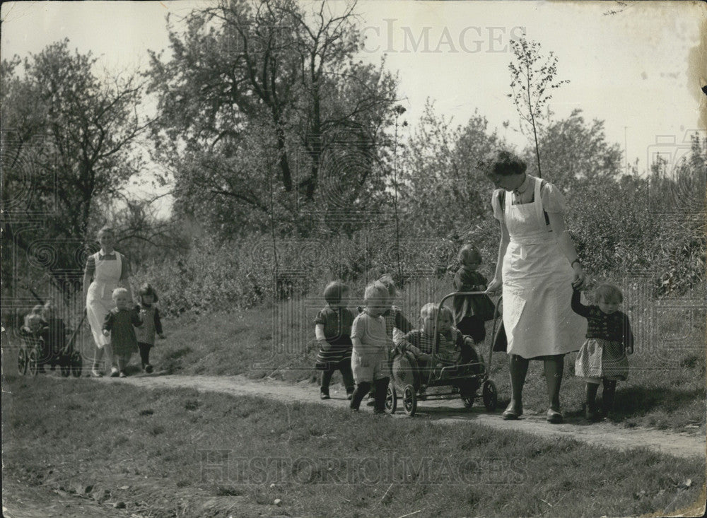 1957 German Women Taking Care of Children. - Historic Images