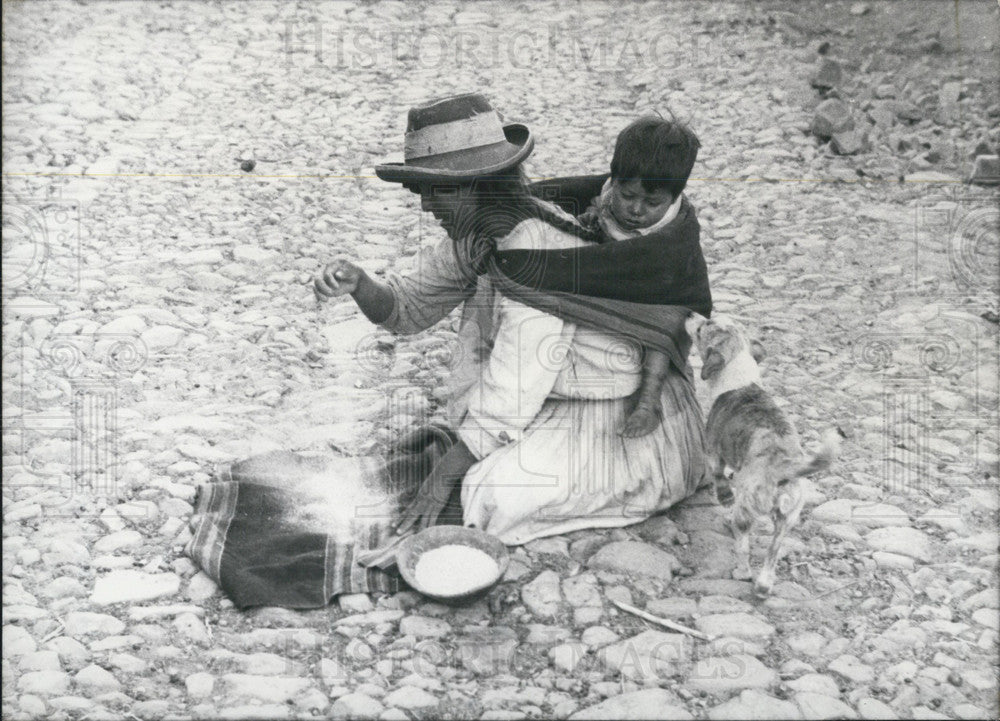 1968, Bolivian Native Sifts Grains. - Historic Images
