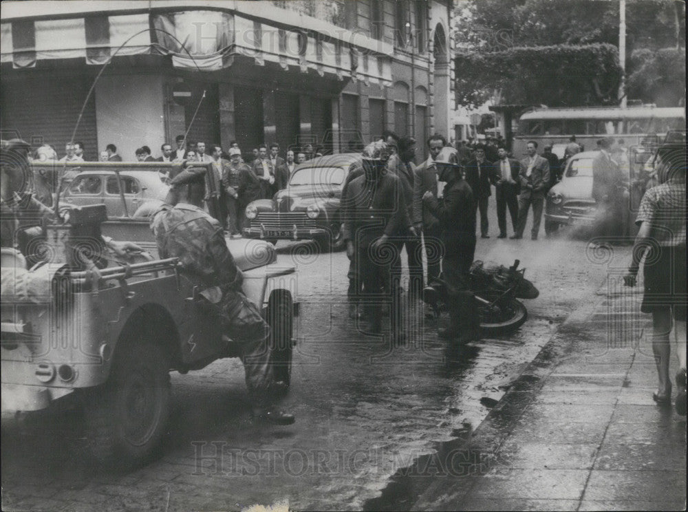 1957 Press Photo Firefighters Put Out Burning Motorcycle and Reestablish Order-Historic Images