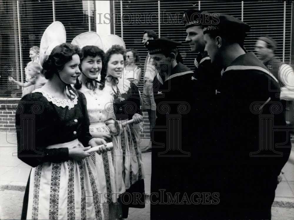 1956 German Navy Officers Meet Saarland Girls in Costume. - Historic Images