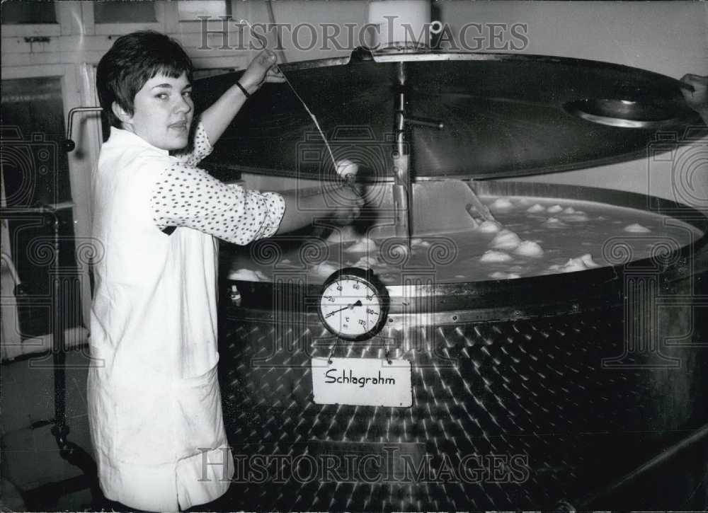 1969 Press Photo Woman Putting Cream in Container. German "Cold Day."-Historic Images