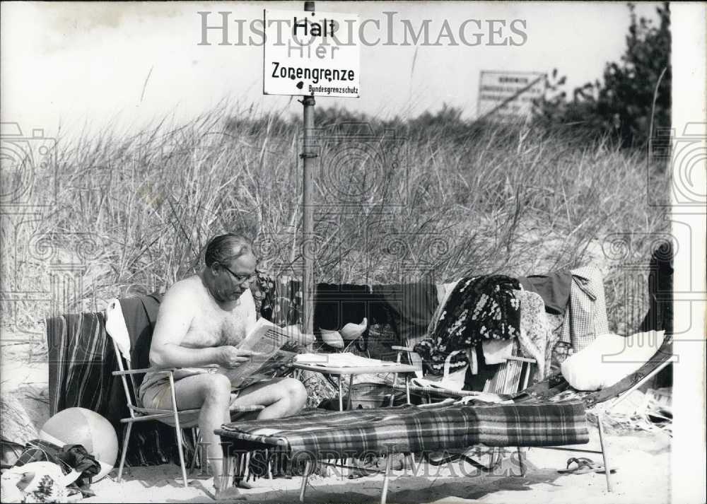 1966 Man on Beach at Zone Border in Luebeck, Germany. Travemuende. - Historic Images