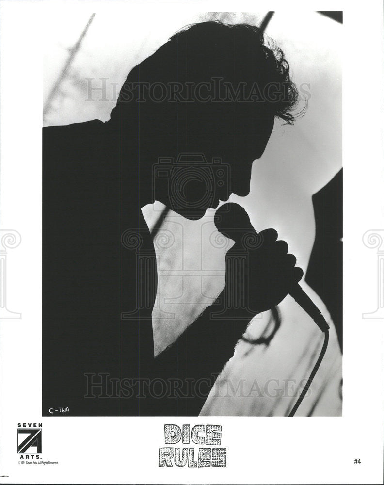 1991 Press Photo Dice Rules Film Andrew Dice Clay Silhouette Holding Microphone - Historic Images