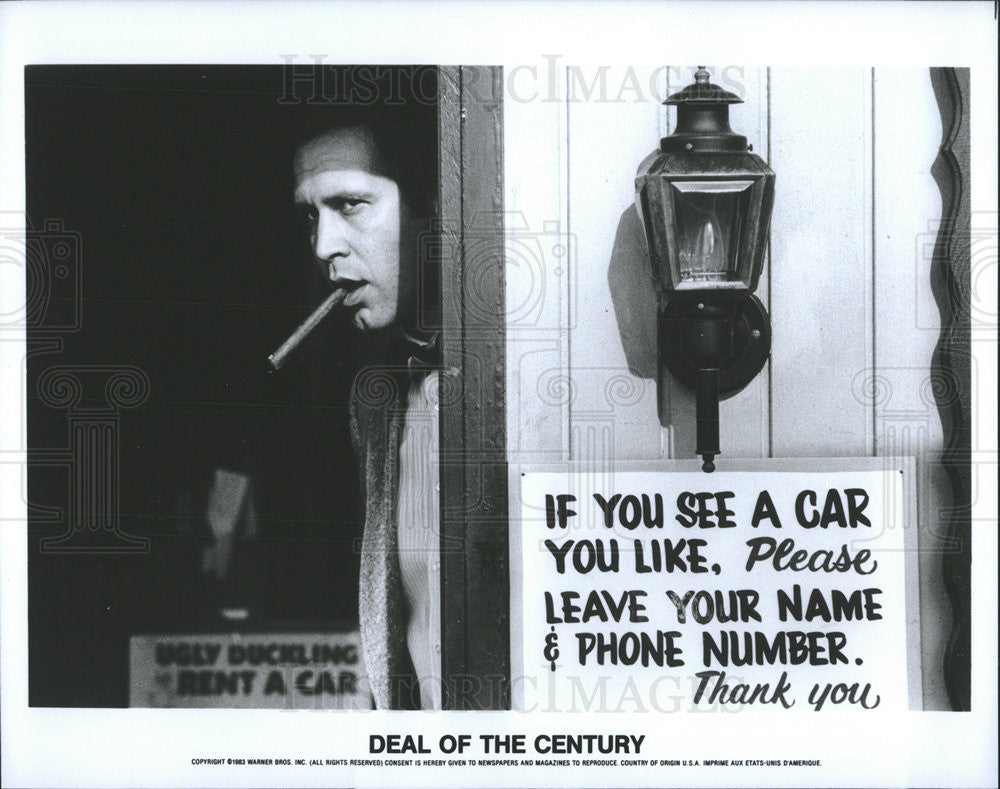 1983 Press Photo Deal of the Century actor smoking cigar - Historic Images