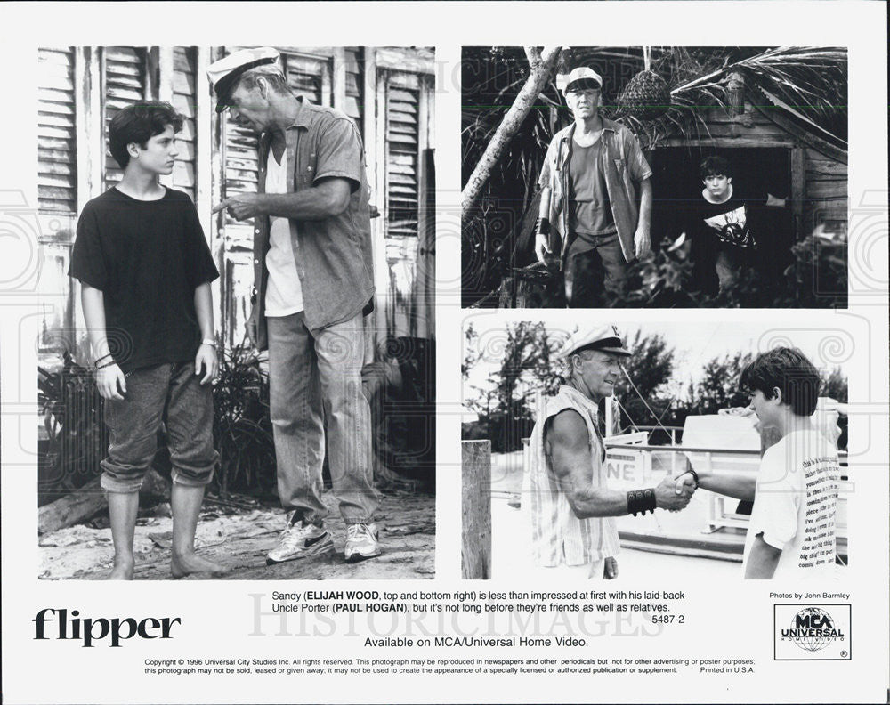 1996 Press Photo Elijah Wood,&amp; Paul Hogan  in &quot;Flipper&quot; - Historic Images