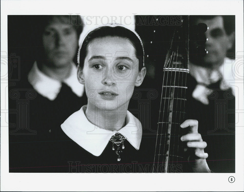 Press Photo Girl plays cello in unknown movie - Historic Images