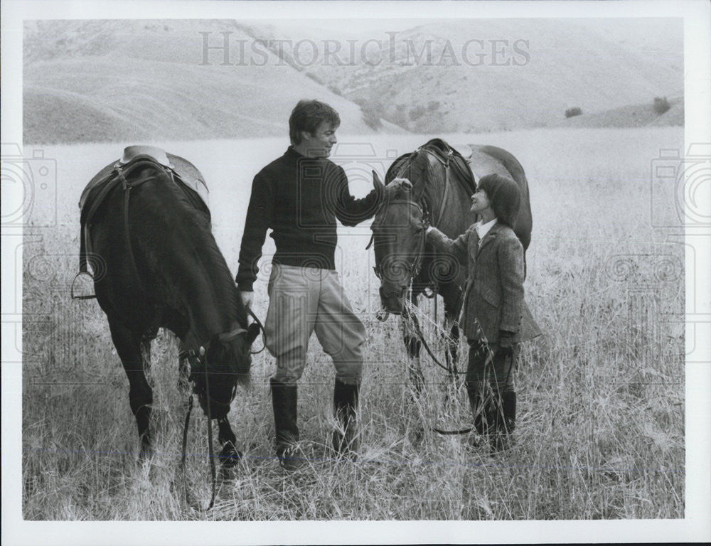 Press Photo in a pasture with horses - Historic Images