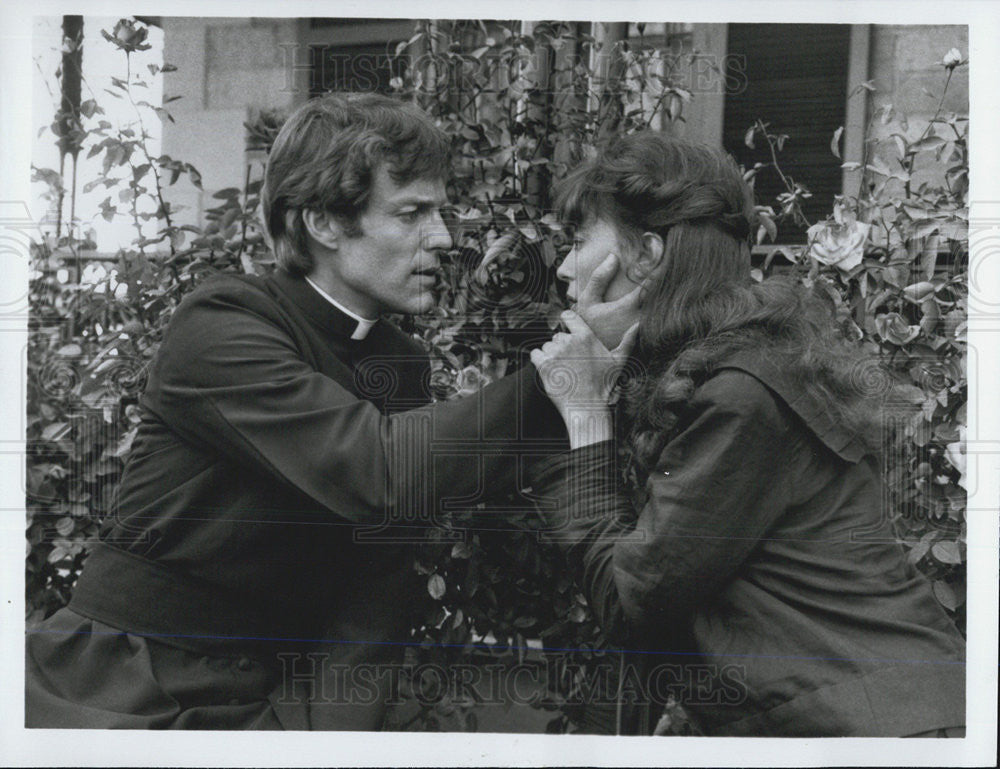 Press Photo Priest and woman in movie scene - Historic Images