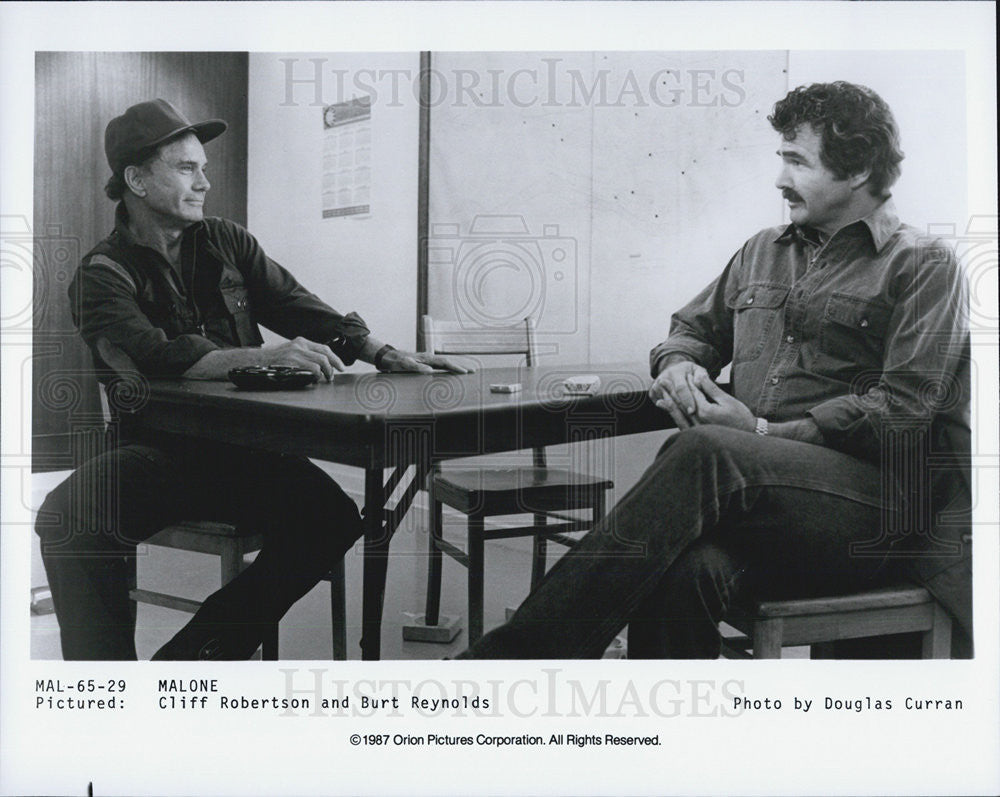 1987 Press Photo Burt Reynolds &amp; Cliff Robertson in &quot;Malone&quot; - Historic Images