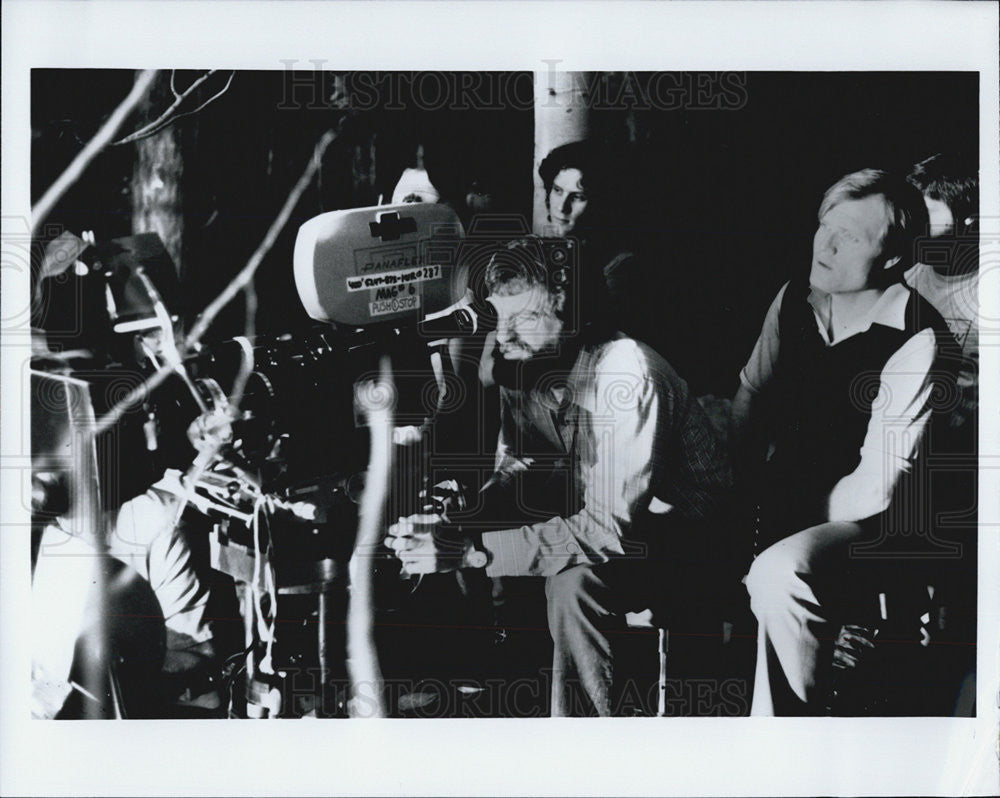 Press Photo in a set filming with director. - Historic Images