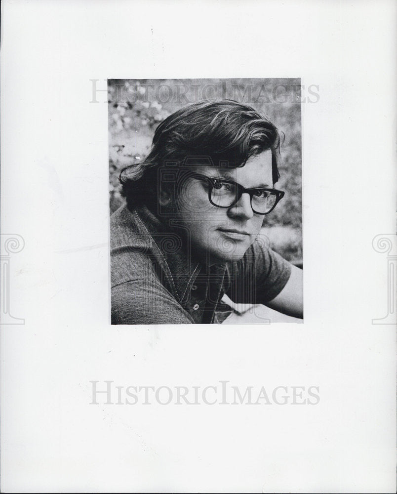 Press Photo Man in glasses poses for portrait - Historic Images