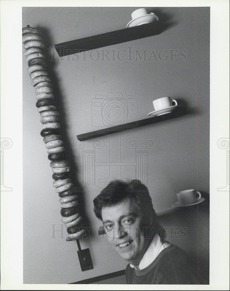 Press Photo Man Sitting Down - Historic Images