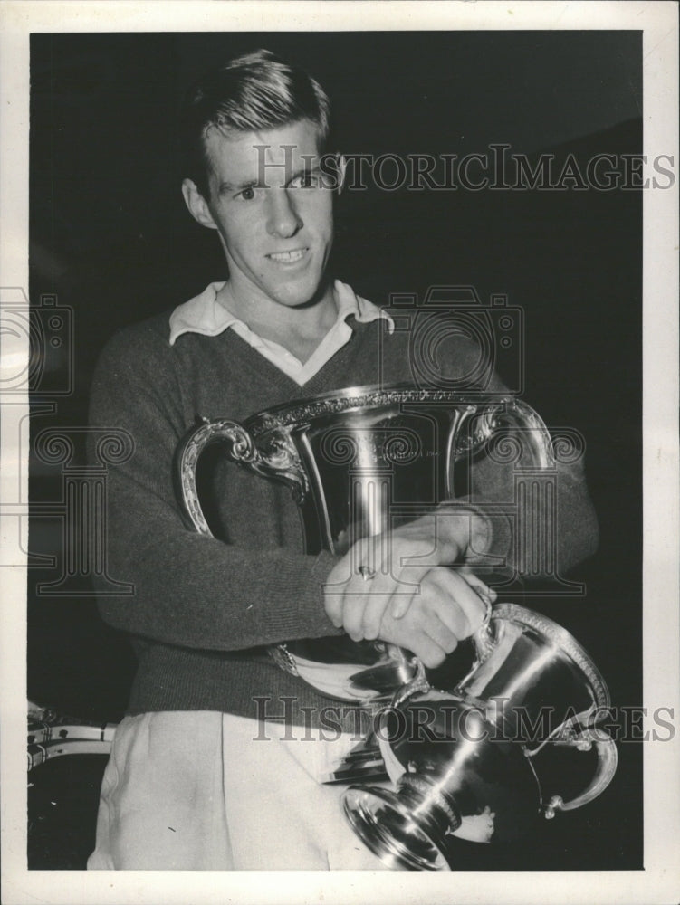 Press Photo A man standing with huge cups - RRQ16425 - Historic Images