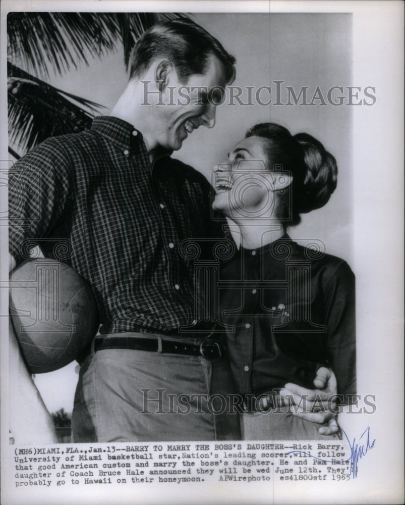1965 Rick Barry hugging his boss daughter  - Historic Images