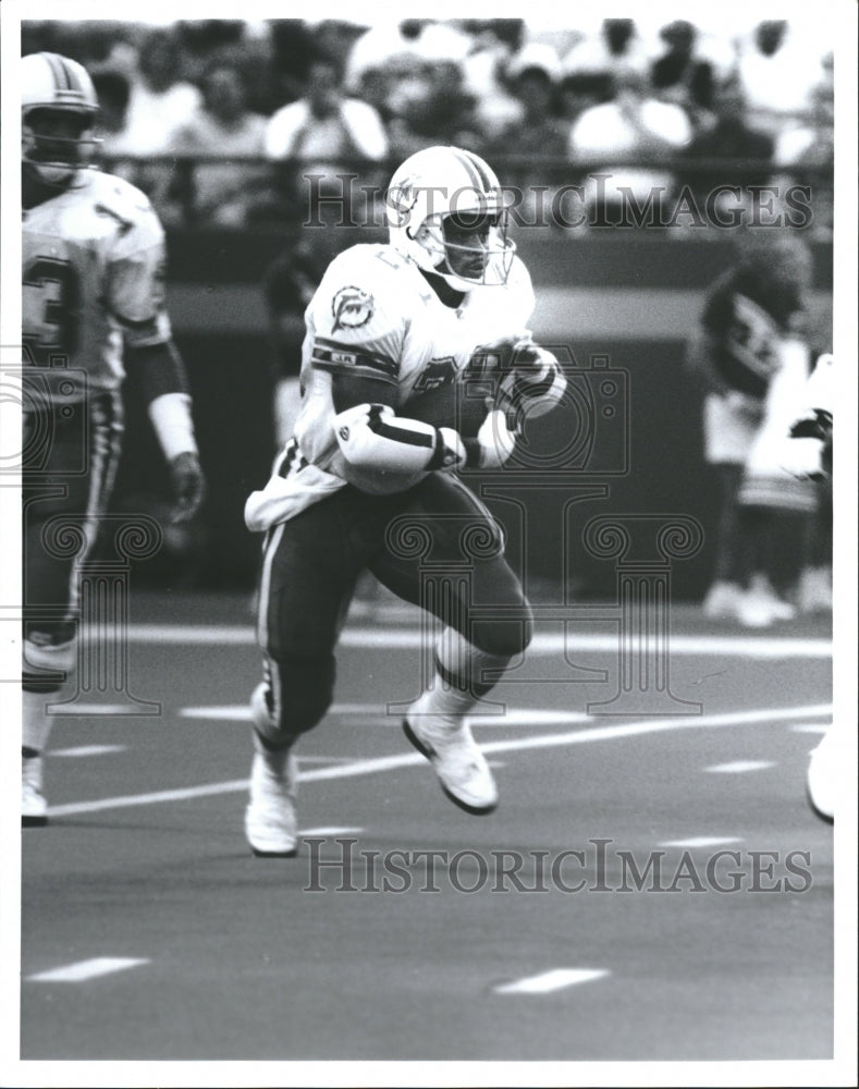 Miami Dolphins Player Higgs Running Ball - Historic Images