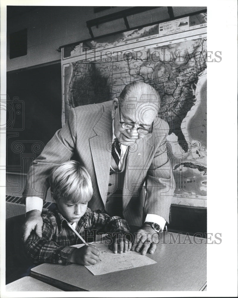 1981 Keith Weaver Helping a Child - Historic Images