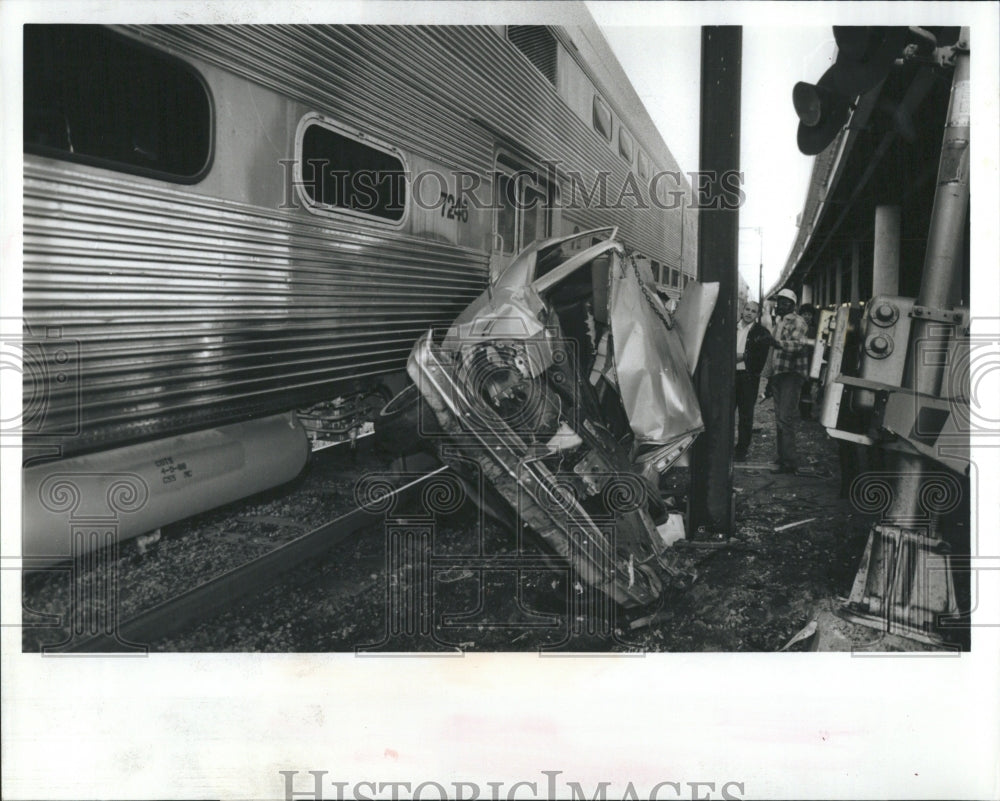 1988 a car featured in accident with train - Historic Images