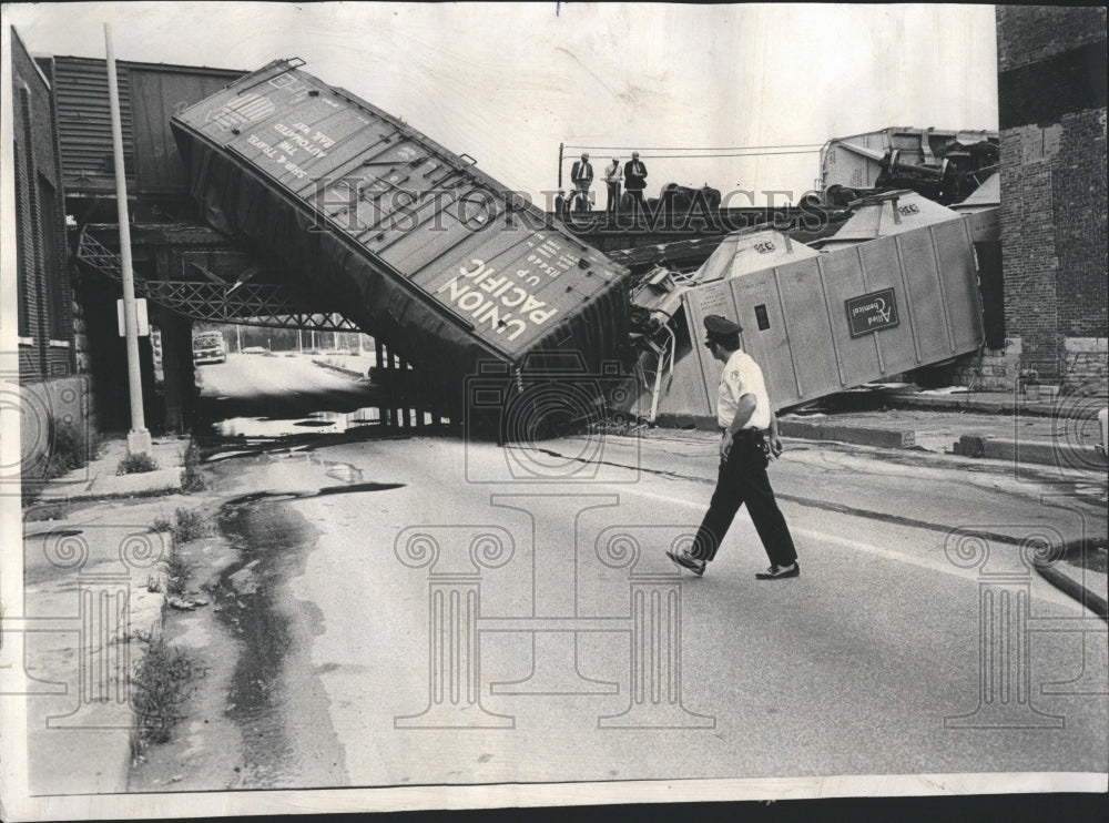 1972 Two cars of freight derailed - Historic Images