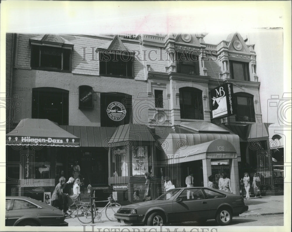  new shops and people along East Oak Street - Historic Images