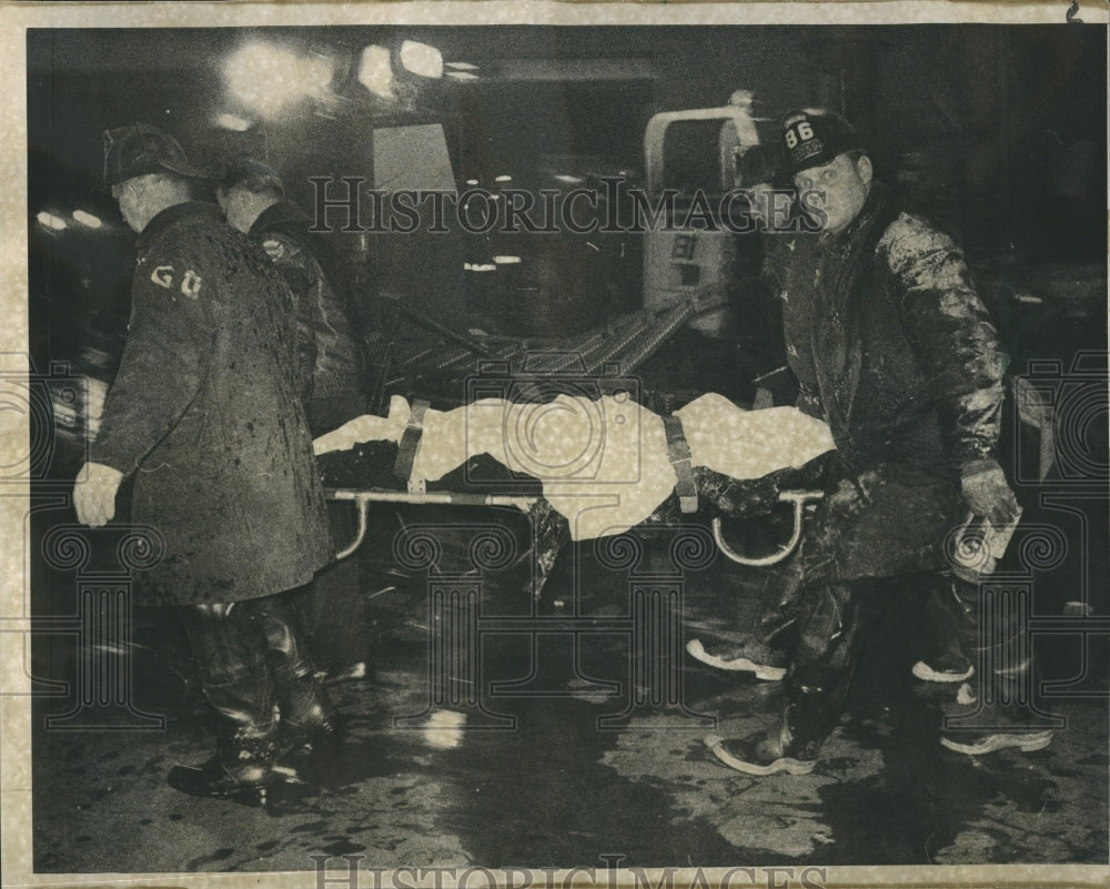 1968 Firemen Remove Body Of Crash Victim - Historic Images