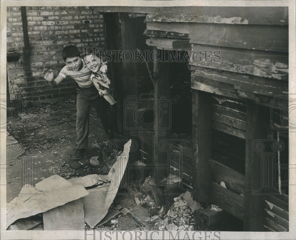1953 Two boys plays in condemned building - Historic Images