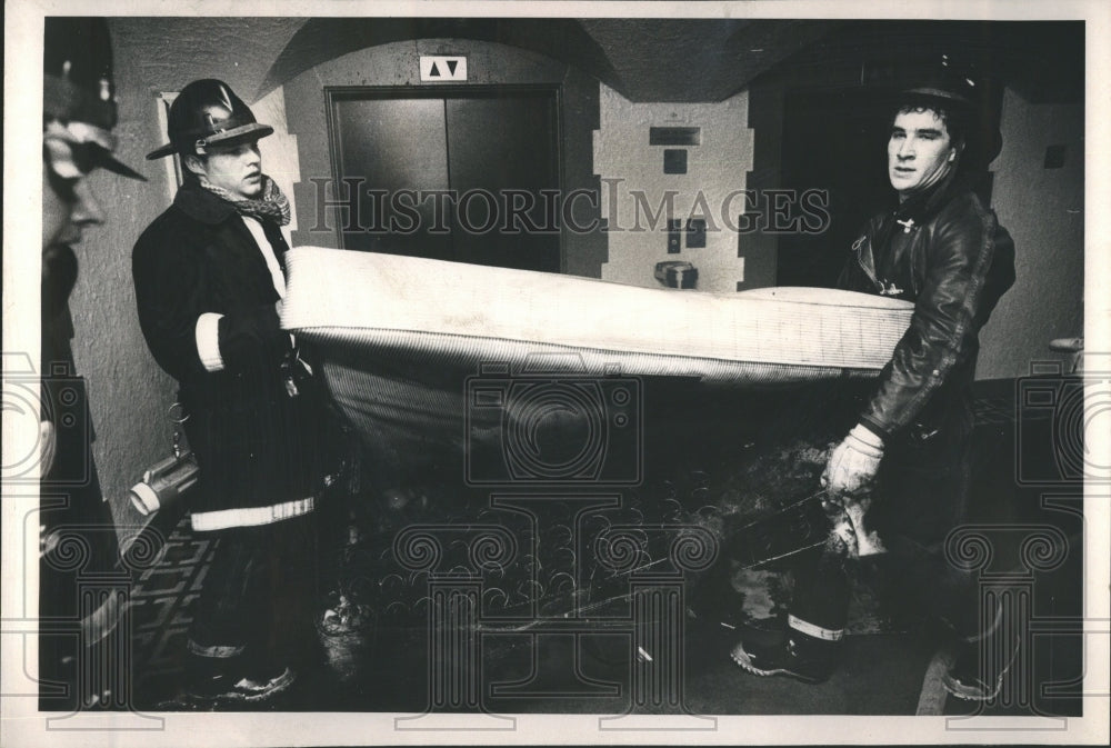 1981 Firemen Carry Burned Mattress Radisson - Historic Images