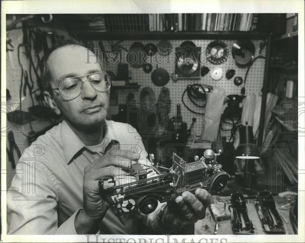 1983 Stuart Gootnick with miniature fire - Historic Images