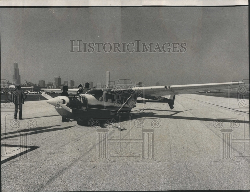 1974 Meigs Field Aircraft runway blocked - Historic Images
