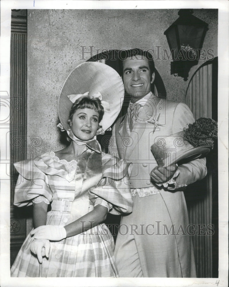 1961 Pass show. Couple in formal wear. - Historic Images
