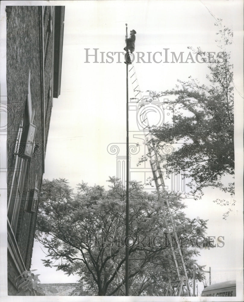 1958 Fireman Bilas Hangs Flagpole Ladder  - Historic Images