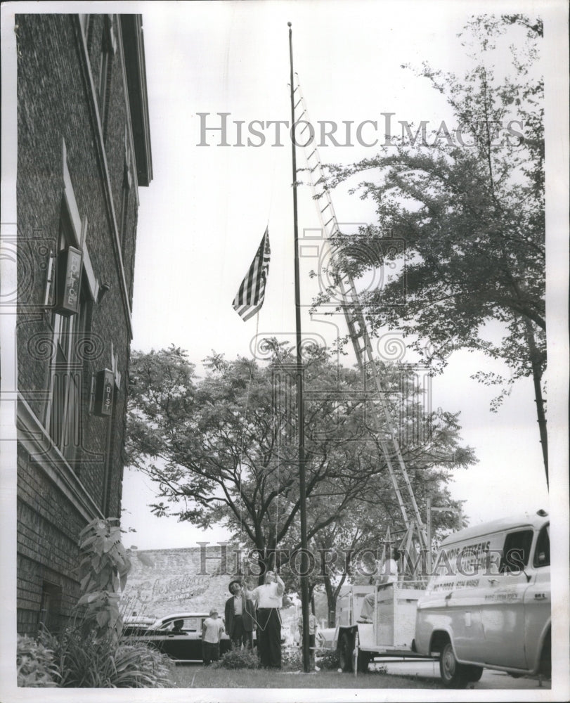 1958 Thomas O&#39;Rourke Hoists Police Flag - Historic Images