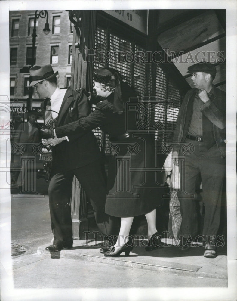 1939 Policewoman Demonstrates Purse Snatch - Historic Images