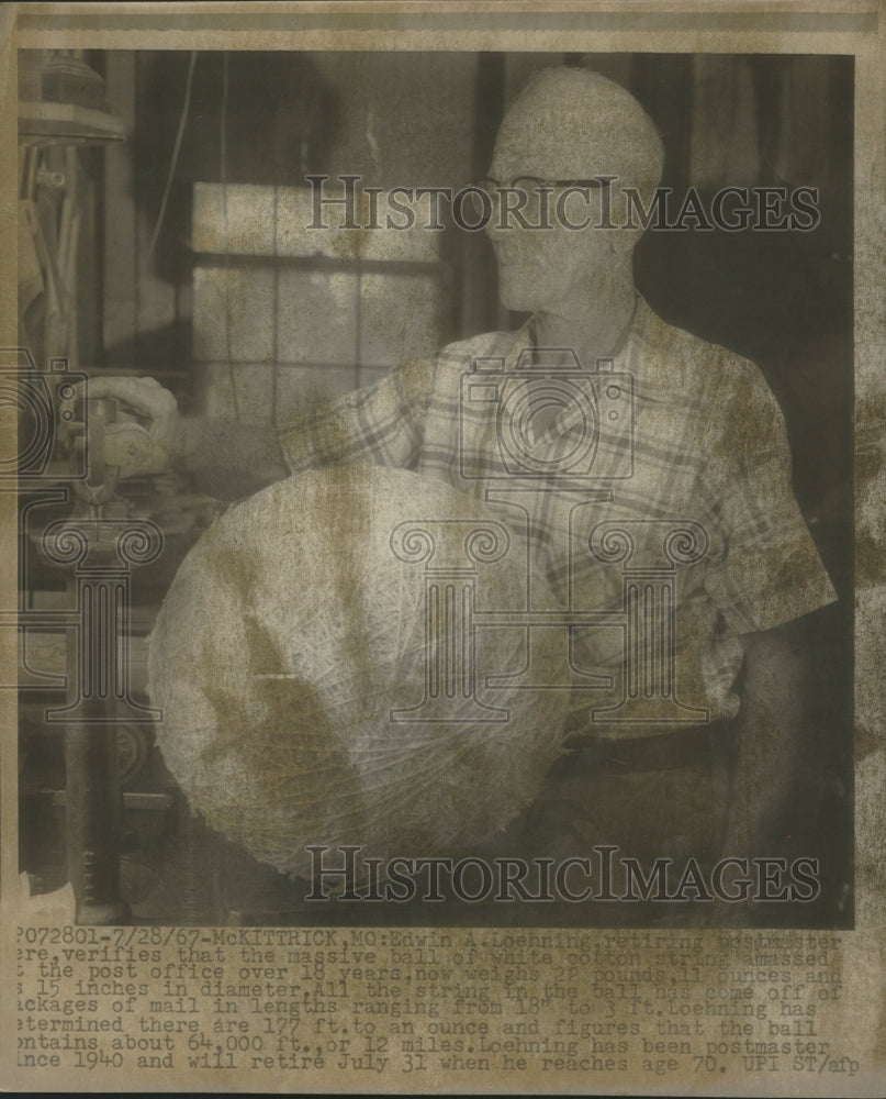 1967 Loehning weighs massive ball of cotton - Historic Images