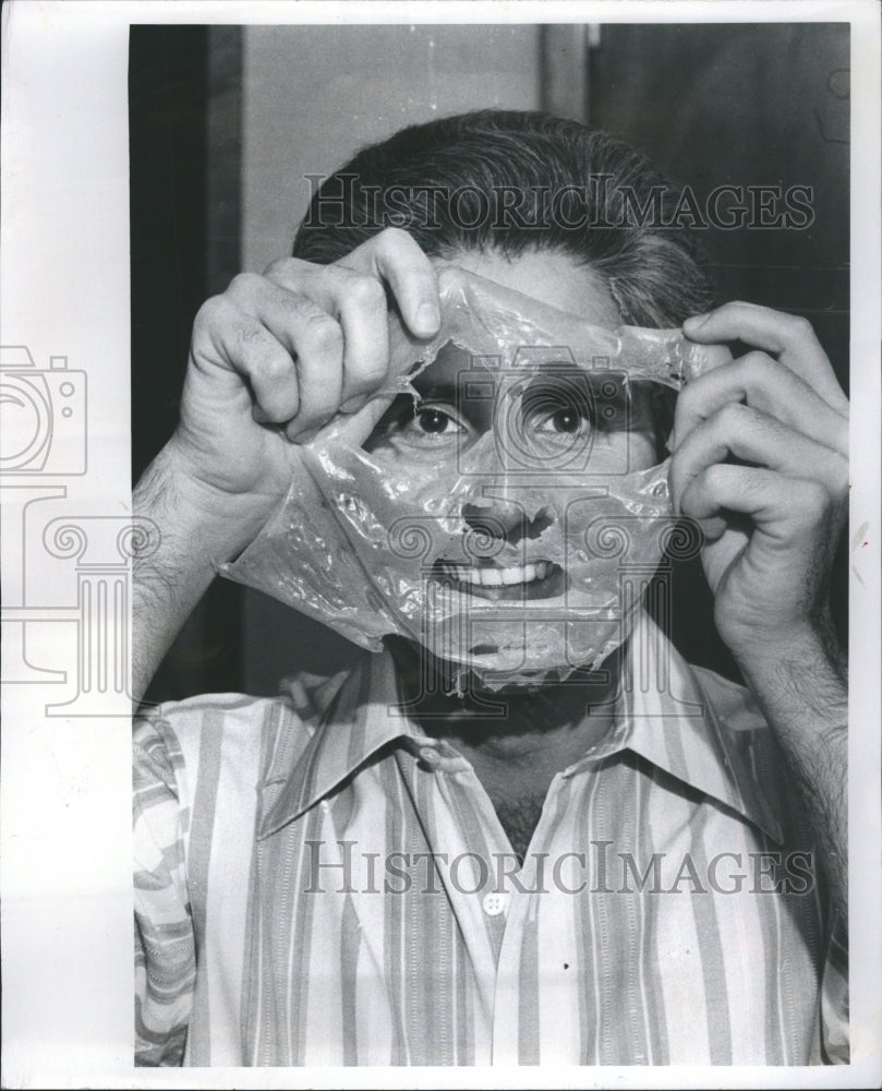 1974 Tom Schoenith trying out mens cosmetic - Historic Images
