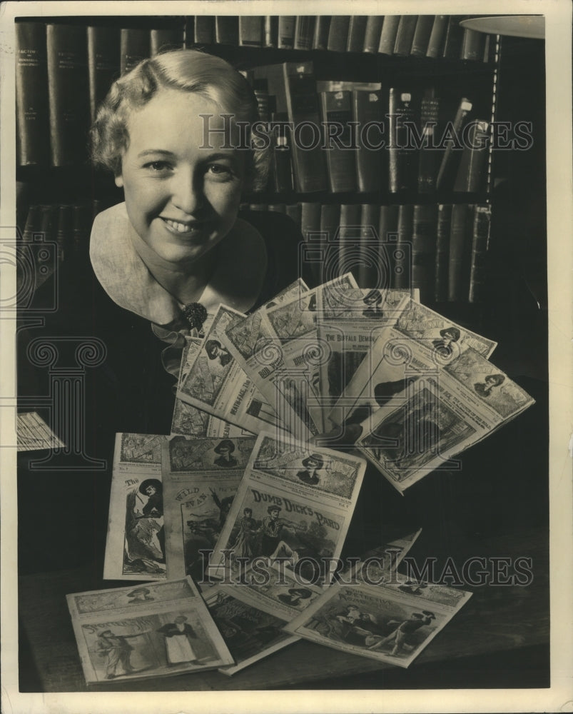 1961 Lady Showing Books Collected for Drive - Historic Images