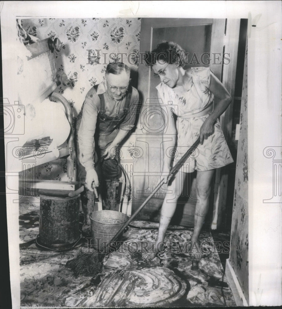 1954  Mickett Begin cleaning Up Mud North D - Historic Images