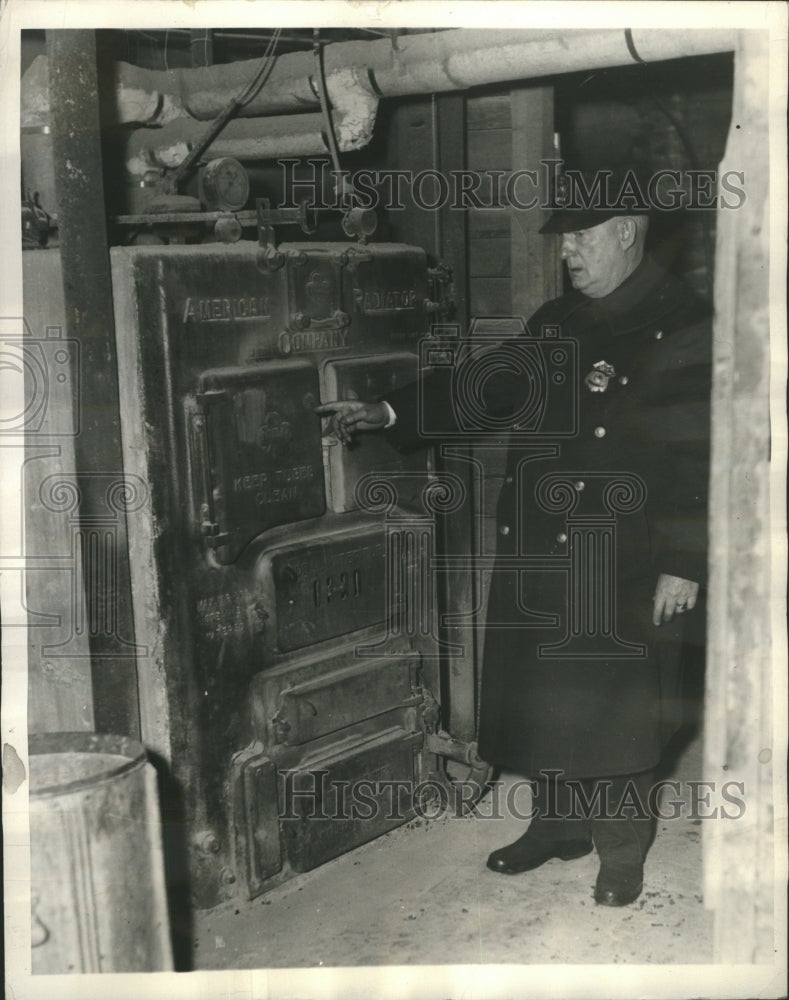 1934 Press Photo Dennis J. Hullisey Inspecting Boiler - Historic Images