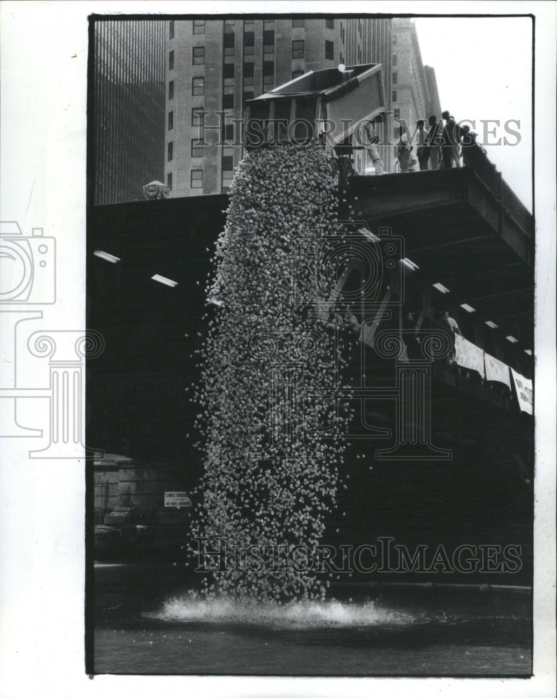 1990 Ducks dump from bridge for race. - Historic Images