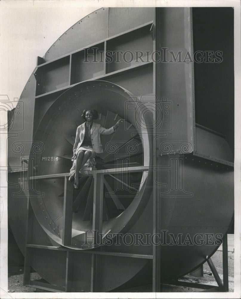 1971 Secretary sits in large fan,CNA Financ - Historic Images