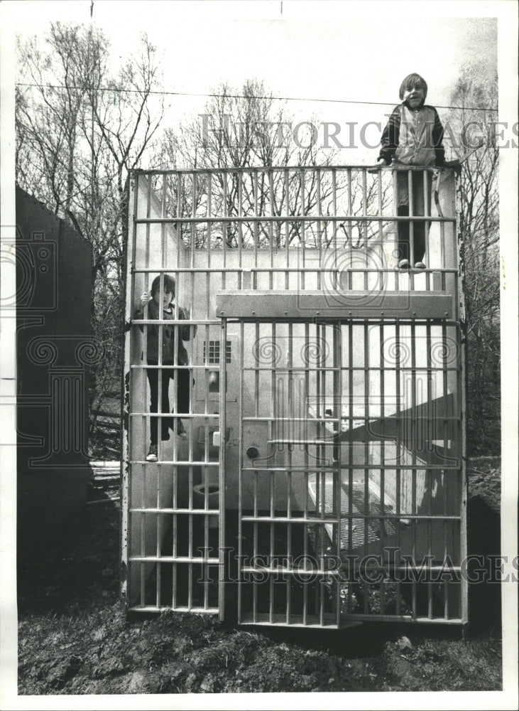 1978 Boys Play Inside Jail Cell in Backyard - Historic Images