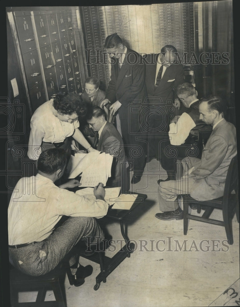 1957 State auditor/examiner check mortgages - Historic Images