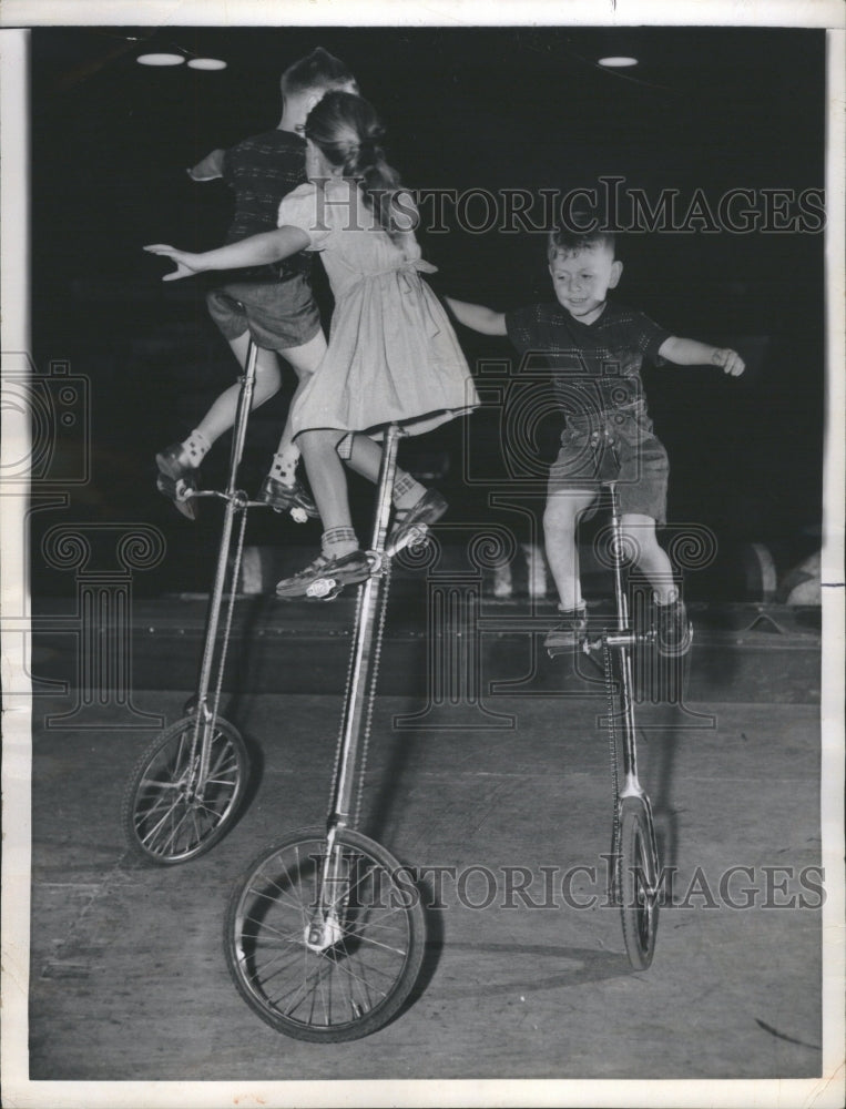 1956 Whiz Kids riding unicycles - Historic Images