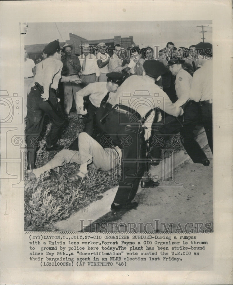 1948 Univis Lens worker thrown to the groun - Historic Images