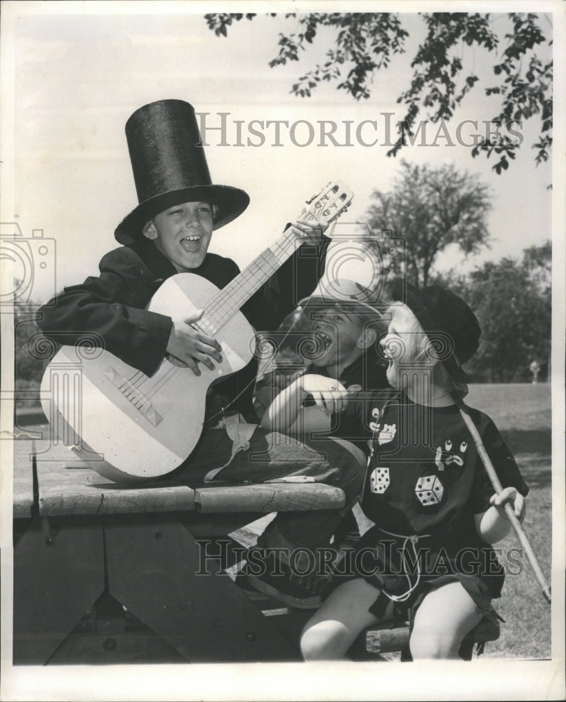 1961 Kids in costume and singing hobo outin - Historic Images