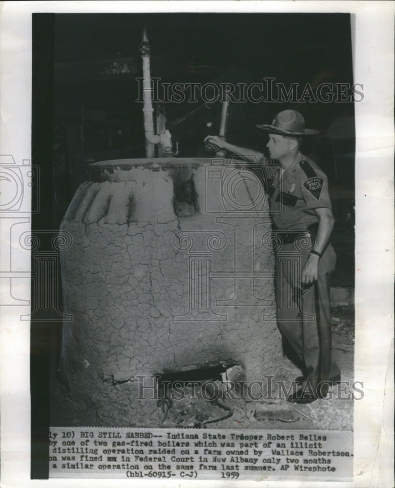 1962 State trooper by gas  - Historic Images