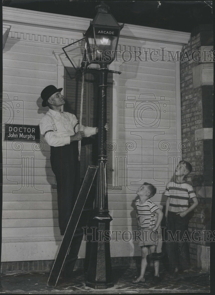 1950 Replica of the past. Old street lamp - Historic Images