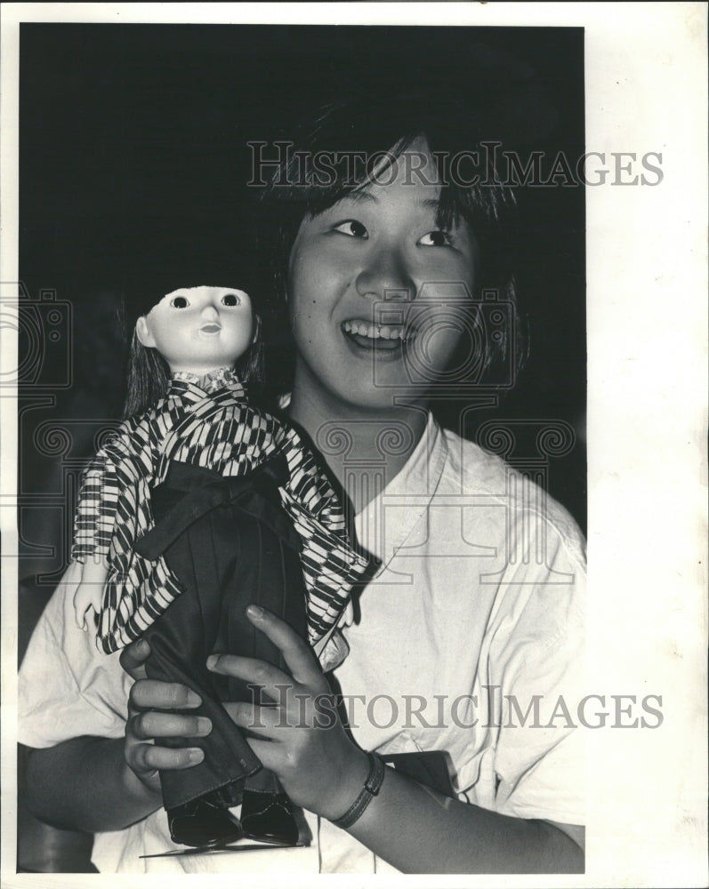 1986 Kazumi Aoki hold doll given to Museum - Historic Images