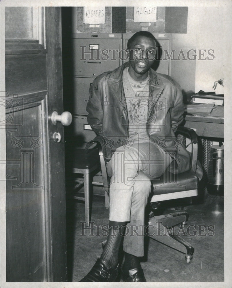 1988 Black Man Office Chair - Historic Images