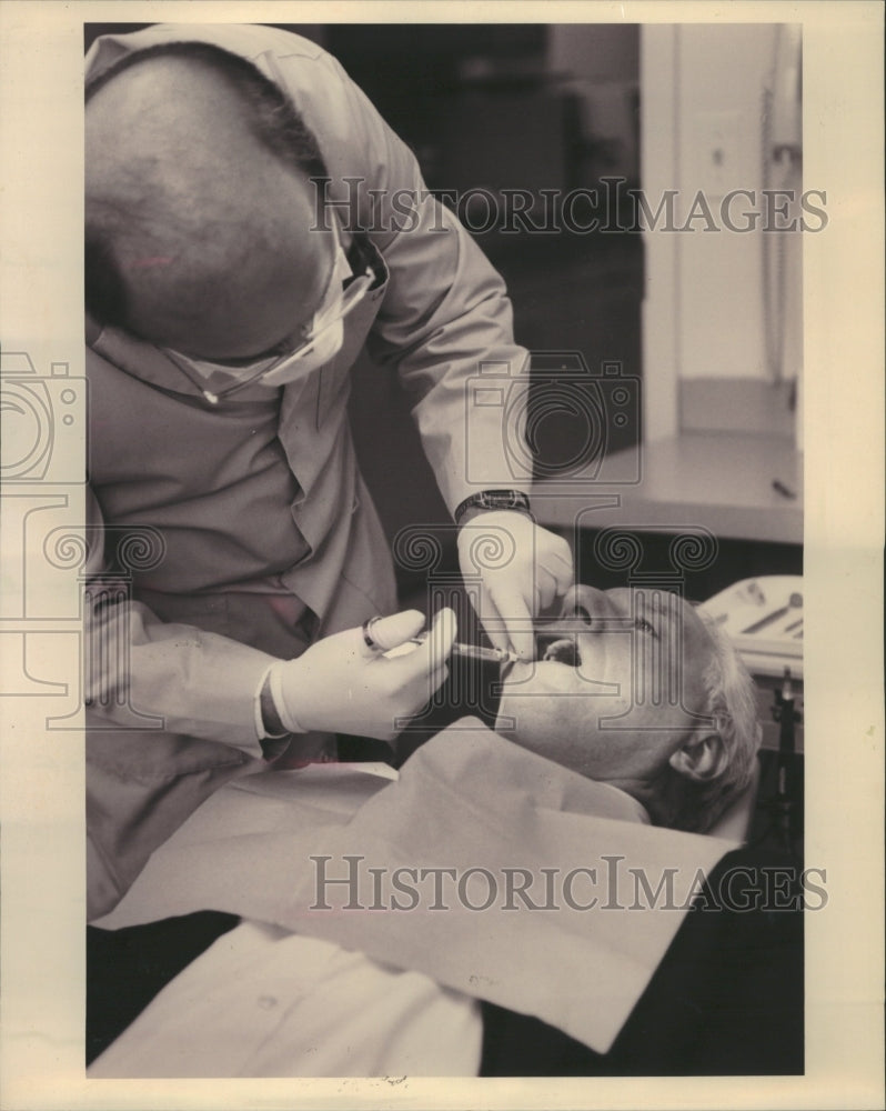 1993 Dentist gives anesthetic injection - Historic Images