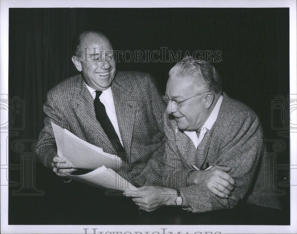 1956 Two Officials Discussing with a smile - Historic Images